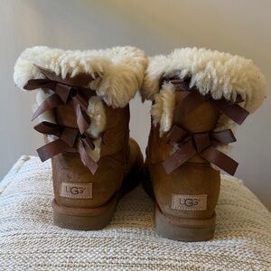 UGG Chestnut Bailey Bow Short Boots with Cream Shearling and Brown Bows